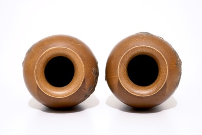 A pair of Chinese Yixing stoneware vases with applied peacock design, 20th C.