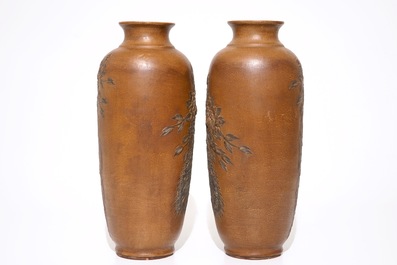 A pair of Chinese Yixing stoneware vases with applied peacock design, 20th C.