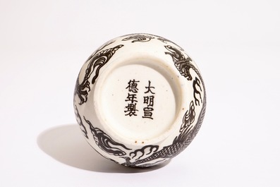 A Chinese black-enamelled biscuit porcelain "dragon" vase, Xuande mark, 18/19th C.