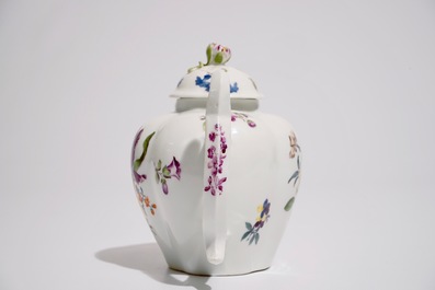 A German porcelain teapot and cover with floral design, 18/19th C.