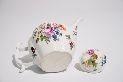 A German porcelain teapot and cover with floral design, 18/19th C.