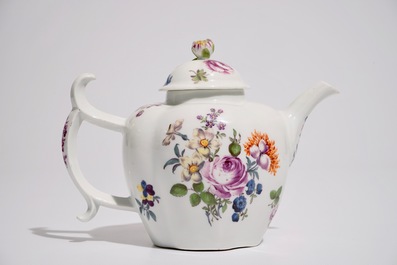 A German porcelain teapot and cover with floral design, 18/19th C.
