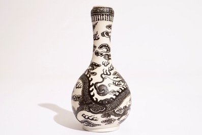 A Chinese black-enamelled biscuit porcelain "dragon" vase, Xuande mark, 18/19th C.
