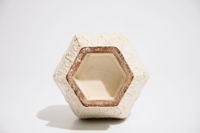 A Chinese white-glazed relief-decorated vase with text bands, 19th C.