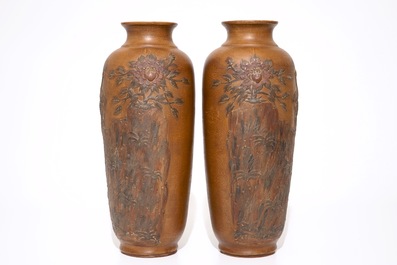 A pair of Chinese Yixing stoneware vases with applied peacock design, 20th C.
