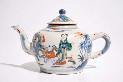 A Chinese wucai teapot and cover with figures in a garden, 19th C.