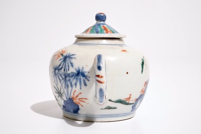 A Chinese wucai teapot and cover with figures in a garden, 19th C.