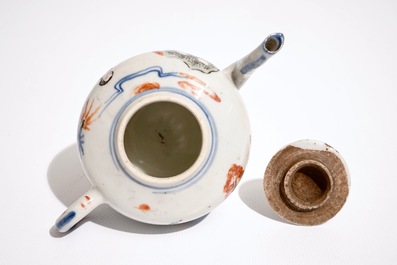 A Chinese wucai teapot and cover with figures in a garden, 19th C.