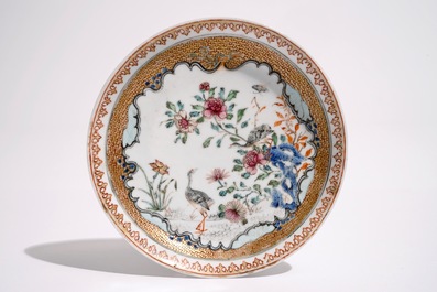 A Chinese famille rose cup and saucer with two egrets, Yongzheng
