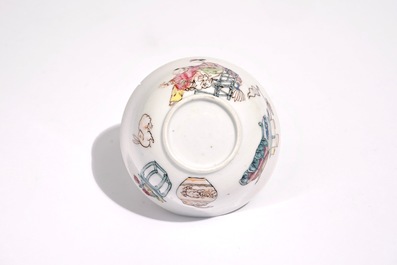 A Chinese famille rose cup and saucer with a lady and a boy, Yongzheng