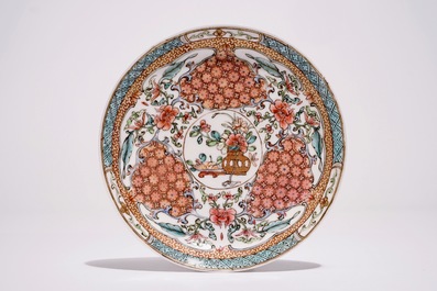 A Chinese famille rose cup and saucer with floral design, Yongzheng