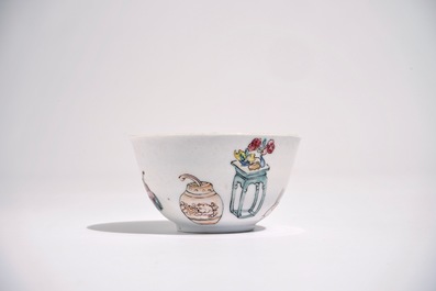 A Chinese famille rose cup and saucer with a lady and a boy, Yongzheng