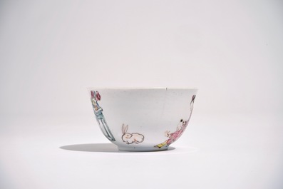 A Chinese famille rose cup and saucer with a lady and a boy, Yongzheng