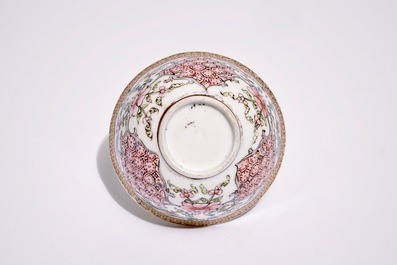 A Chinese famille rose cup and saucer with floral design, Yongzheng
