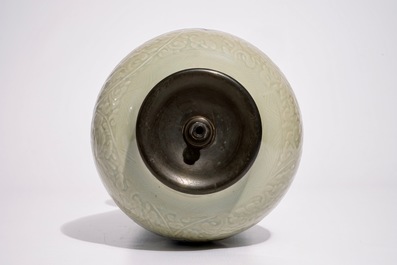 A Chinese blue and white on carved celadon-glazed ground vase, mounted as lamp, Kangxi