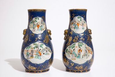 A pair of Chinese famille verte on powder blue and gilt ground vases, 19th C.