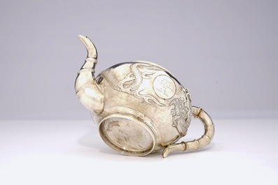An inscribed Chinese silver teapot with dragon design, ca. 1936
