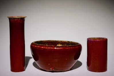 A Chinese monochrome sang-de-boeuf-glazed brush pot, a beaker vase and a bowl, 19/20th C.