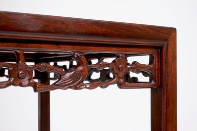 A set of four Chinese sculpted hardwood stacking tables, 20th C.
