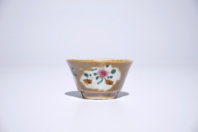 Nine Chinese famille rose on capucin brown ground cups and saucers, Qianlong