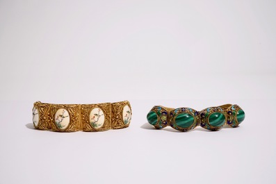 Un ensemble de bijoux en argent dor&eacute; et &eacute;maill&eacute;, ivoire peint et malachite, d&eacute;but du 20&egrave;me
