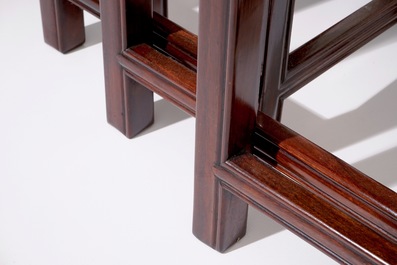 A set of four Chinese sculpted hardwood stacking tables, 20th C.