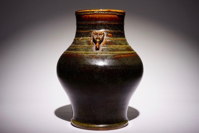 A Chinese monochrome tea-dust-glazed hu vase, Qianlong mark, 19th C.