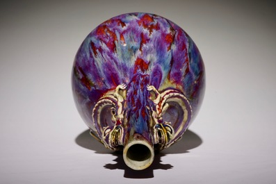 A Chinese monochrome flambe-glazed bottle vase with dragon handles, 19th C.
