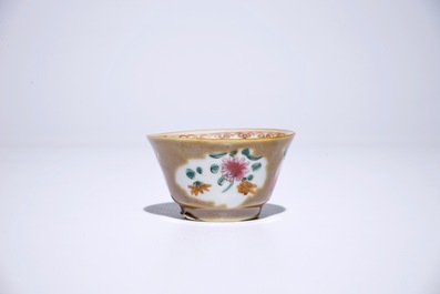 Nine Chinese famille rose on capucin brown ground cups and saucers, Qianlong