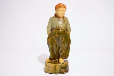 A Flemish pottery figure, "The little farmer", prob. Laigneil workshop, 20th C.