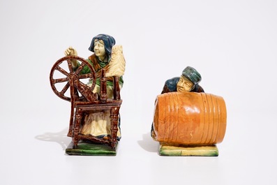 Two Flemish pottery figures of a lace maker and a barrel pusher, prob. Laigneil workshop, 20th C.