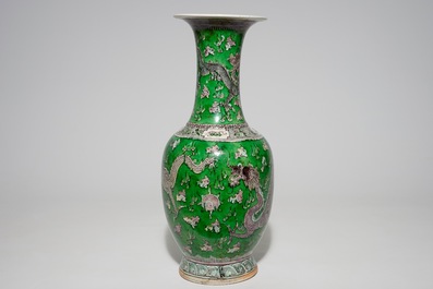 A Chinese green ground dragon vase, a small rouleau vase and a verte biscuit figure, 19th C.