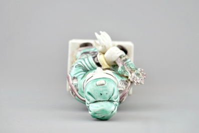 A Chinese green ground dragon vase, a small rouleau vase and a verte biscuit figure, 19th C.