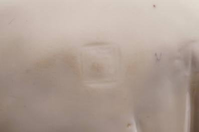A Chinese Dehua blanc de Chine model of a standing Buddha, impressed mark on the back, Kangxi