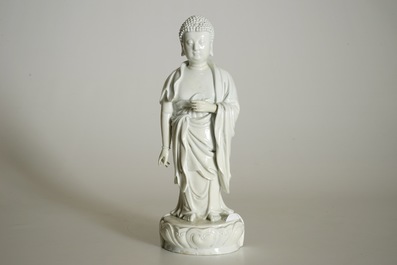 A Chinese Dehua blanc de Chine model of a standing Buddha, impressed mark on the back, Kangxi