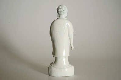 A Chinese Dehua blanc de Chine model of a standing Buddha, impressed mark on the back, Kangxi