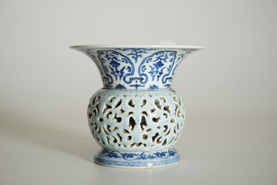 A rare blue, white and lavender-glazed reticulated revolving zhadou spittoon, Qianlong mark, 19/20th C.