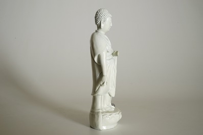 A Chinese Dehua blanc de Chine model of a standing Buddha, impressed mark on the back, Kangxi