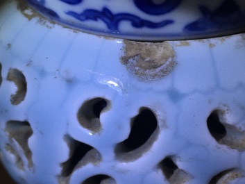 A rare blue, white and lavender-glazed reticulated revolving zhadou spittoon, Qianlong mark, 19/20th C.