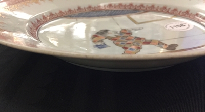 A polychrome Chinese "South Sea bubble" plate with a harlequin, Kangxi/Yongzheng