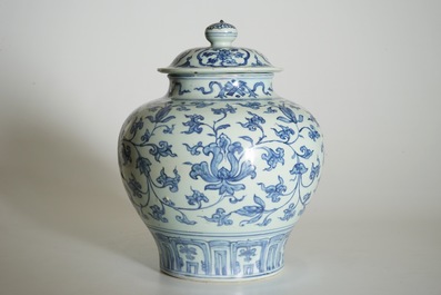 A Chinese blue and white peony scroll vase and cover, Ming, Wanli