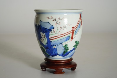 A Chinese wucai brush pot on wooden stand, Transitional period