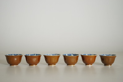 Six Chinese blue and white on capucin brown ground cups and saucers, Kangxi