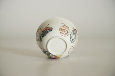 A Chinese famille rose cup and saucer with a lady and a boy, Yongzheng