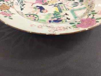 A Chinese famille rose plate with figures in a garden, Yongzheng
