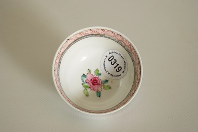 A Chinese famille rose cup and saucer with a lady and a boy, Yongzheng