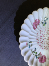 A Chinese famille rose lotus-shaped relief-decorated cup and saucer, Yongzheng