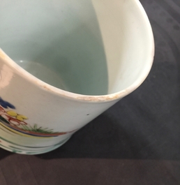 A cylindrical Chinese famille rose brushpot with figures in a garden, Qianlong