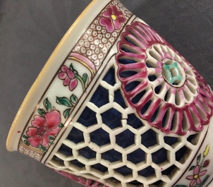 A Chinese double-walled famille rose cup and saucer, Yongzheng/Qianlong