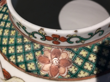 A Chinese famille rose warriors jar with wooden cover, 19th C.